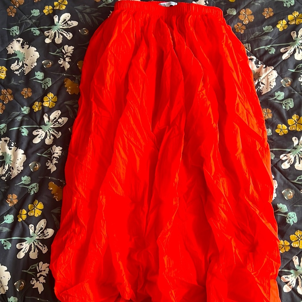 Bright reddish orange skirt, no holes or damadge, used around once or twice